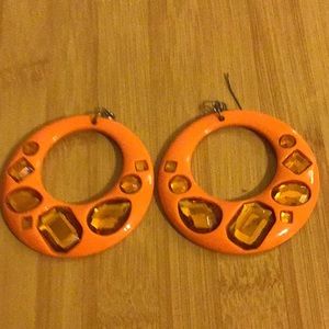 Peach earrings with gold jewel tones